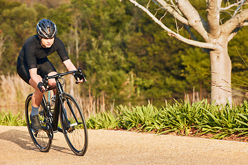 Image showing Summer, fitness and cycling with woman on dirt path in nature for workout, training and sports competition. Strong, cardio and exercise with female cyclist riding on bike for adventure and journey