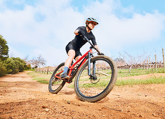 Image showing Bicycle, fitness outdoor and woman on a cycling with freedom for sports race on gravel road. Fitness, exercise and athlete doing sport training in nature on park trail for cardio and healthy workout