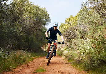 Image showing Race, fitness and cycling with woman on dirt path in nature for workout, training and competition. Strong, cardio and exercise with female cyclist riding on mountain bike for adventure and journey