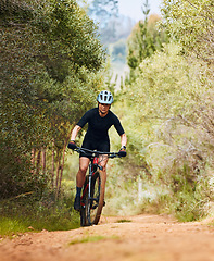 Image showing Action, fitness and cycling with woman on dirt path in nature for workout, training and competition. Strong, cardio and exercise with female cyclist riding on mountain bike for adventure and journey