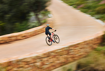 Image showing Cycling man, speed and bicycle in nature on countryside bridge for training, wellness and fitness. Cyclist, mountain bike and sustainable travel in summer for adventure, health and workout on road