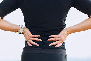 Image showing Hands, woman and back pain during fitness, training or workout routine outdoors, discomfort and sore. Spine, issue and female with sports injury, problem and ache, fibromyalgia or accident