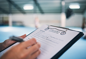 Image showing Hand, documents and contract in gym with a coach watching a performance for membership sign up or checklist. Paper, assessment and personal trainer in a sports center for fitness, planning or review