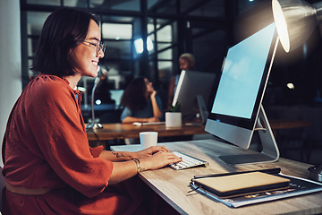 Image showing Night, business and woman typing, smile and focus on data analysis, email and project deadline. Female employee, creative and worker with a computer, screen and working late for digital planning