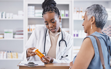 Image showing Black woman, doctor and prescription medication for patient or over the counter pills at pharmacy. African medical pharmacist consulting senior client for dosage, symptoms or side effects at clinic