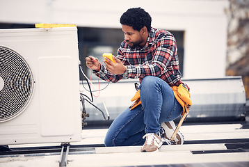 Image showing Air conditioner, roof and technician man repair, maintenance and working on electrical power generator. African electrician person, handyman or contractor with electricity, cables check and services