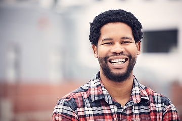 Image showing Happy, smile and portrait of black man in city for holiday, vacation and freedom on weekend outdoors. Travel, happiness and face of male with confidence, positive mindset and excited in urban town