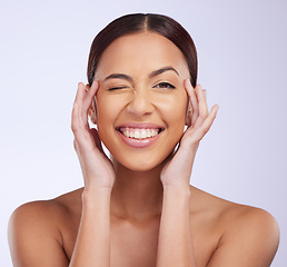 Image showing Woman portrait, beauty wink and skincare in a studio with happiness and smile from dermatology. Skin glow, facial and cosmetics of a young female model feeling happy from self care and face wellness