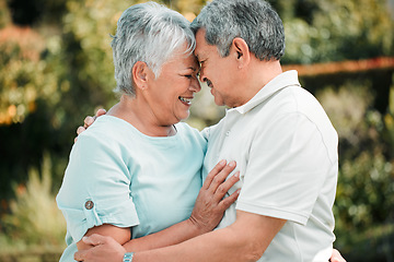 Image showing Happy senior couple, face touch and hug in park, garden and peace of care, happiness and love together. Elderly man, woman and retirement of marriage partner, relax or smile of quality time in nature