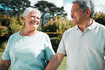 Image showing Happy senior couple walking in park, garden and nature of love, care or happiness together. Elderly man, woman and retirement with partner, relax and quality time outdoor in marriage, peace or summer