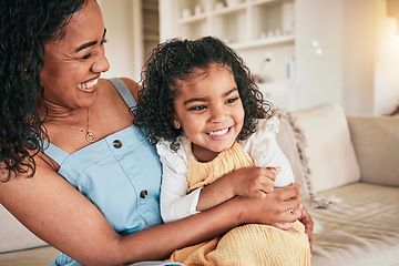 Image showing Happy, hug and laughing with mother and daughter on sofa for bonding, affectionate and love. Support, cuddle and smile with woman and young girl in living room at home for relax, care and embrace