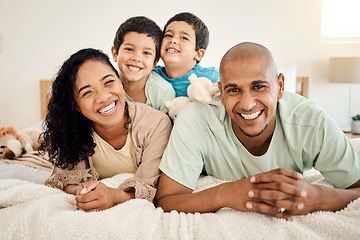 Image showing Family, bed and portrait of parents and kids bonding in a bedroom in a house and playing together. Smile, mother and father happy and excited with children in the morning as love and care