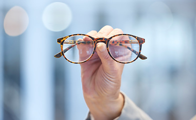 Image showing Optometry, vision and optometrist hand with glasses for eye care, optical wellness and healthcare. Medical, optic and closeup of woman with spectacles with stylish frame and prescription lens in shop