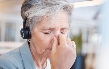 Image showing Senior woman, headache and tired at call center with stress from consulting, telemarketing or crm job. Elderly female, tech support consultant and exhausted in office with burnout, fatigue or anxiety