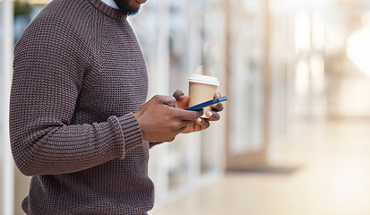 Image showing Hands, coffee and texting with phone in office, social media or typing in workplace mockup. Cellphone, tea and black man or business person browsing online, networking or internet messaging on break.