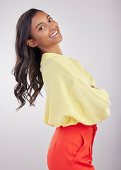 Image showing Happy, confident and the portrait of a woman with arms crossed isolated on a white background. Smile, stylish and a girl standing with empowerment, positivity and confidence on a studio backdrop