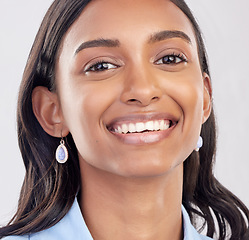 Image showing Face, teeth and portrait of woman relax feeling happy, confident and excited isolated on a studio white background. Employee, dental care and Indian female worker with oral or mouth hygiene