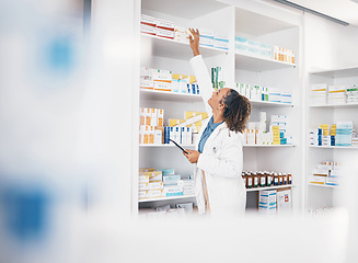 Image showing Tablet, pharmacy or woman by shelf with medicine pills or supplements products to check drugs inventory. Blurry, doctor or pharmacist checking boxes of medical stock or retail medication checklist