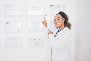 Image showing Certificate, medical and pointing with portrait of woman for success, graduation and pride. Achievement, happy and smile with female and showing award wall for education, healthcare and pharmacy