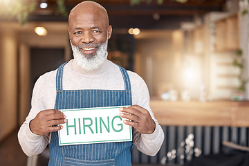 Image showing Man, hiring sign and portrait in cafe small business recruitment, hire or job opportunity. Happy African male, senior or coffee shop owner or employer with poster for recruiting or advertising board