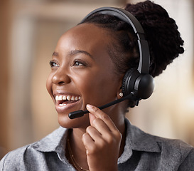 Image showing Call center, black woman and happy in contact us, CRM and headset with mic and communication. Customer service consultant, female and smile in telemarketing sales vision and help desk agent in office