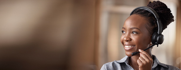 Image showing Call center, black woman and smile in contact us with CRM, headset with mic and mockup space. Customer service consultant, happy female and telemarketing with sales and help desk banner in office