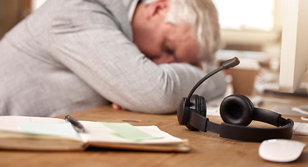 Image showing Call center, sleeping and tired man by headset in office with burnout of sales and customer service. Mature agent or consultant in telemarketing, support and crm with mental health or fatigue problem