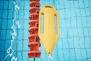 Image showing Above, water and a buoy in a pool for safety, life saving and floating help. Board, summer and equipment for protection, security and danger while swimming, rescuing and protecting from drowning