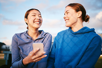 Image showing Laugh, women and friends with smartphone, outdoor and connection for social media, typing and smile. Female athlete, contact and happy girls outside, cellphone and mobile app for fun, meme and funny