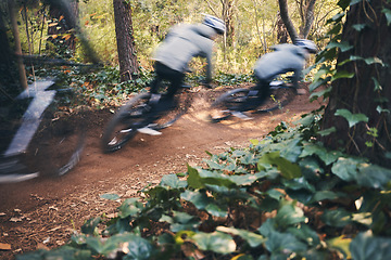 Image showing Fitness, cycling, and race with men in nature for training, extreme sports and motion blur. Workout, fast and speed with cyclist on bike in forest park for performance, challenge and adventure