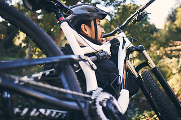 Image showing Forest, man carry and mountain bike in nature of a cyclist ready for training, exercise and bicycle workout outdoor. Athlete, cycling and off road biking of male doing sports for health and wellness