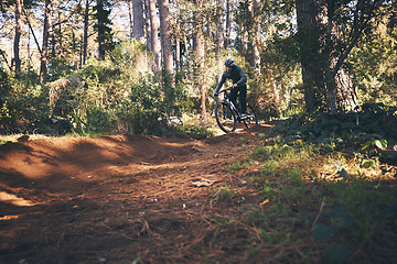 Image showing Fitness, bicycle and man outdoor on a hill path with extreme and exercise adventure. Bike, cycling and sport of an athlete with fast speed and nature cycle for sports training and race action