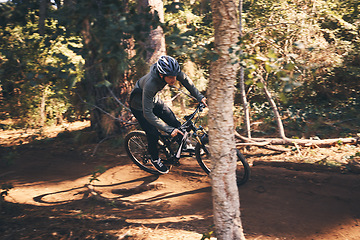 Image showing Fitness, bicycle ride and man outdoor on a forest path with extreme and exercise adventure. Bike, cycling and sport of an athlete with fast speed and nature cycle for sports training and race action