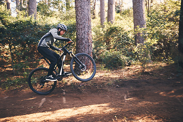 Image showing Cycling, nature and cardio with man on path for training, workout or fitness exercise. Adventure, extreme sports and speed with male cyclist on bike in forest park for performance, challenge or break