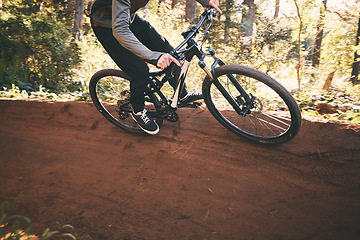 Image showing Fitness, bicycle workout and man outdoor on a forest path with extreme and exercise adventure. Bike, cycling and sport of an athlete with fast speed and nature hill for sports training and action