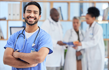 Image showing Hospital, doctor and portrait of man in healthcare clinic for insurance, wellness and medical service. Medicine, professional and health worker smile with crossed arms for care, consulting and help