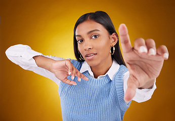 Image showing Selfie hand, woman and portrait in studio isolated on a brown background. Face, profile picture and Indian person taking photo for serious memory, social media or photography on a backdrop.