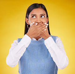 Image showing Shock, omg and young female in a studio with her hand on her mouth for a wtf expression. Shocked, ecstatic and Indian woman model with wow or surprise face for good news isolated by yellow background