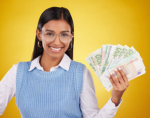 Image showing Studio cash money, portrait and woman smile for lottery prize, competition win or dollar bills award. Finance winner, payment or person winning poker, giveaway or casino gambling on yellow background