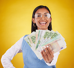 Image showing Money bills, studio portrait and woman smile for lottery win, competition giveaway or cash award. Finance bonus, payment or prize winner of poker, bingo or casino gambling on yellow background