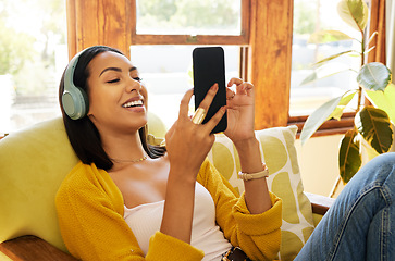 Image showing Woman, smartphone and headphones, smile at social media and communication, technology and listening to music. Online chat, happy female relax at home with app and podcast, games and scroll internet