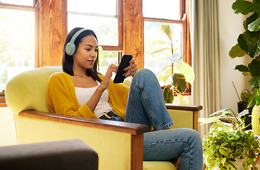 Image showing Woman, smartphone and headphones, social media and listening to music with communication and technology. Online chat, female relax at home with mobile app and podcast, games and scroll internet