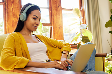 Image showing Woman, laptop and remote work, headphones for listening to music while working from home. Female freelancer, copywriter for blog or website with radio or podcast streaming, typing and productivity