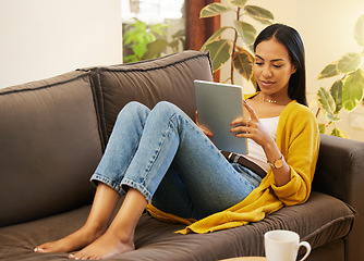 Image showing Relax, social media and woman on couch, tablet and watching videos in living room, break and chilling. Female, device and person on sofa, online reading and connection in home and searching internet