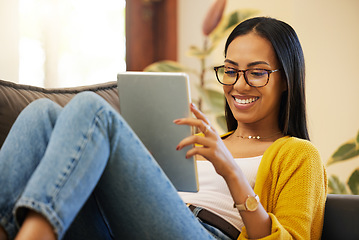 Image showing Tablet, relax and woman reading in home living room on sofa, social media or ebook. Technology, touchscreen and happy person web scrolling, online browsing or streaming video, movie or film in lounge