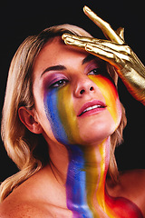 Image showing Woman, beauty face and gold color paint and cosmetics on skin in studio. Female model person on a black background for art deco, fantasy and creative rainbow makeup with metallic hand on head