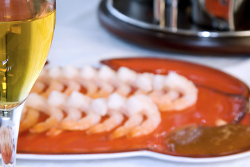 Image showing Shrimps on a Plate with the Wine Glass in Focus