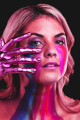 Image showing Woman, hand on face and beauty portrait with metallic color paint cosmetics on skin in studio. Female model person on a black background for art deco, fantasy and creative makeup with a neon light