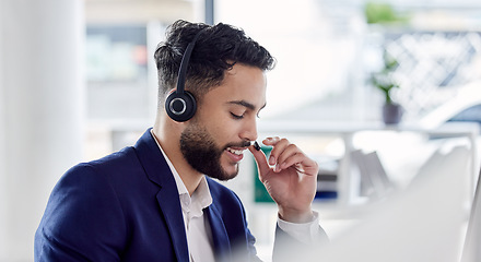 Image showing Customer service, support and communication with a consultant man using a headset while working in an office. Contact us, crm and consulting with a happy young male employee at work in a call center