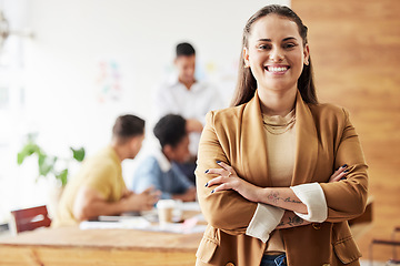 Image showing Business woman, portrait and arms crossed for leadership, smile and excited at startup office. Female manager, young and happiness on face for success with team, entrepreneurship or career management